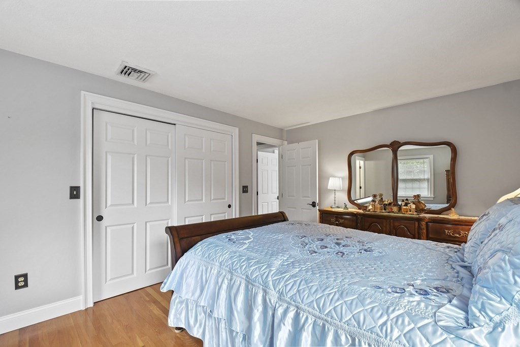 33 Old Farm Road Reading, MA 01867 - Photo 24 of 42 a bedroom with a bed and a dresser