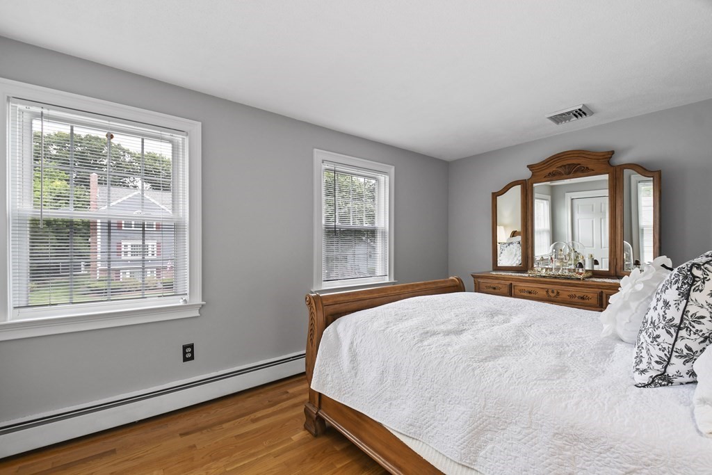 33 Old Farm Road Reading, MA 01867 - Photo 26 of 42 a bed sitting in a bedroom next to a window