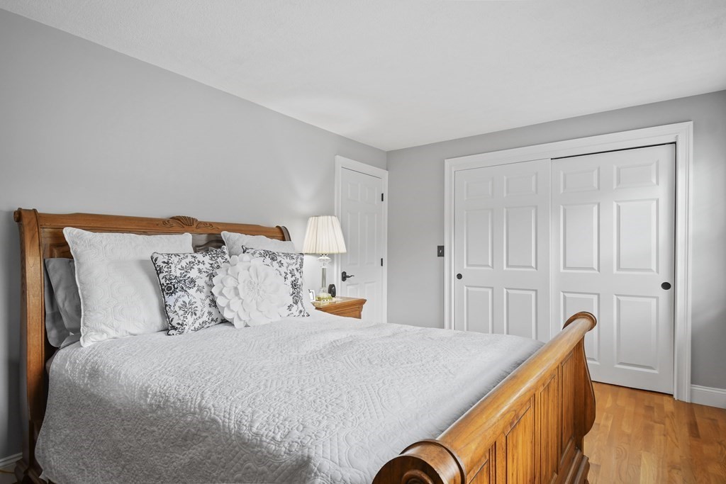 33 Old Farm Road Reading, MA 01867 - Photo 28 of 42 a bed room with a bed and a couch