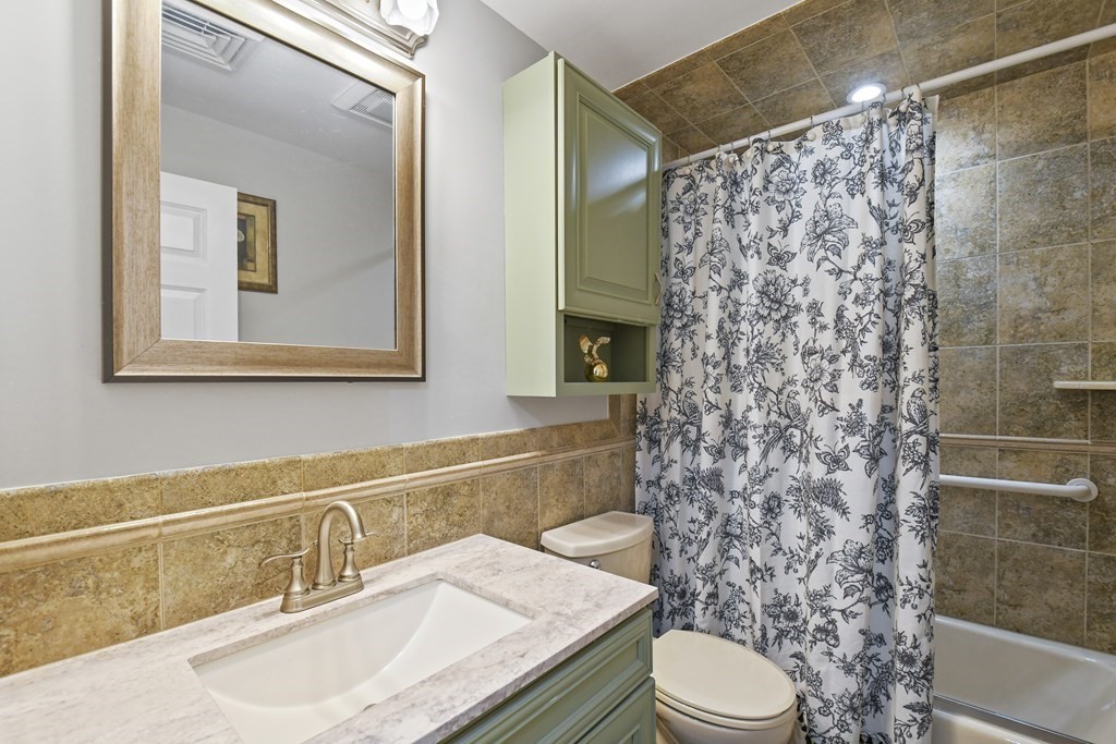 33 Old Farm Road Reading, MA 01867 - Photo 29 of 42 a bathroom with a sink toilet and shower