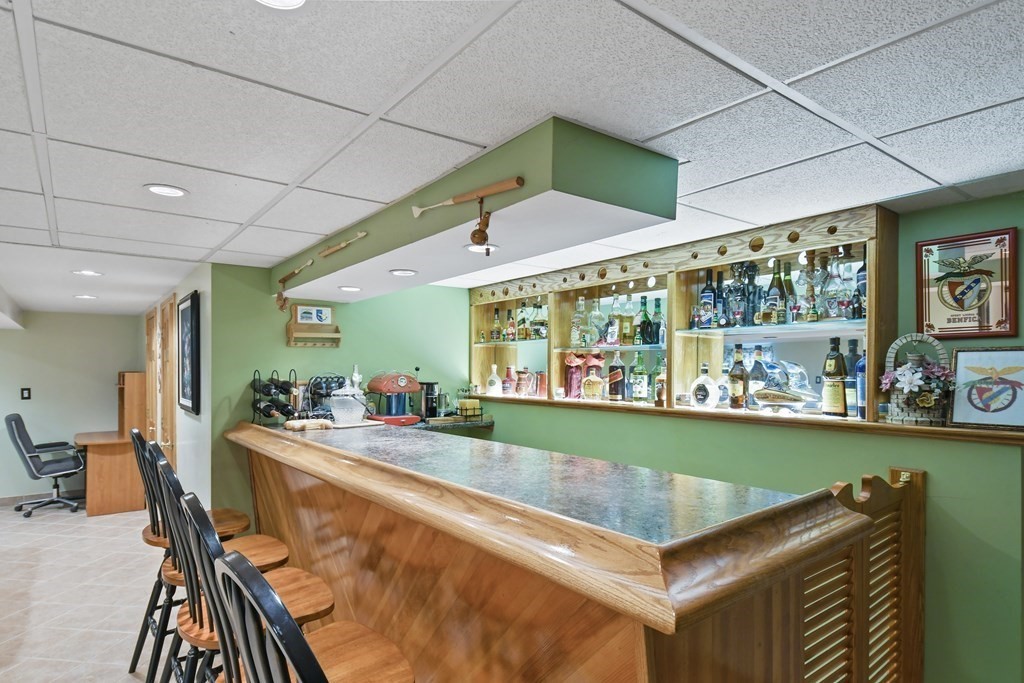 33 Old Farm Road Reading, MA 01867 - Photo 35 of 42 a room with furniture and a large window