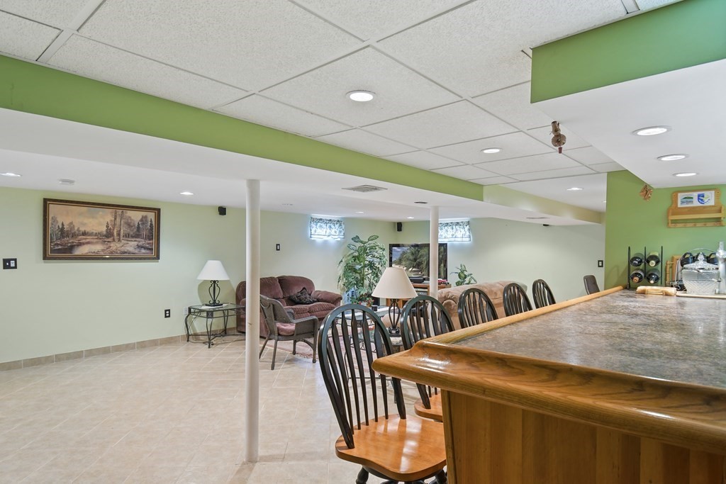 33 Old Farm Road Reading, MA 01867 - Photo 36 of 42 a view of a dining room with furniture