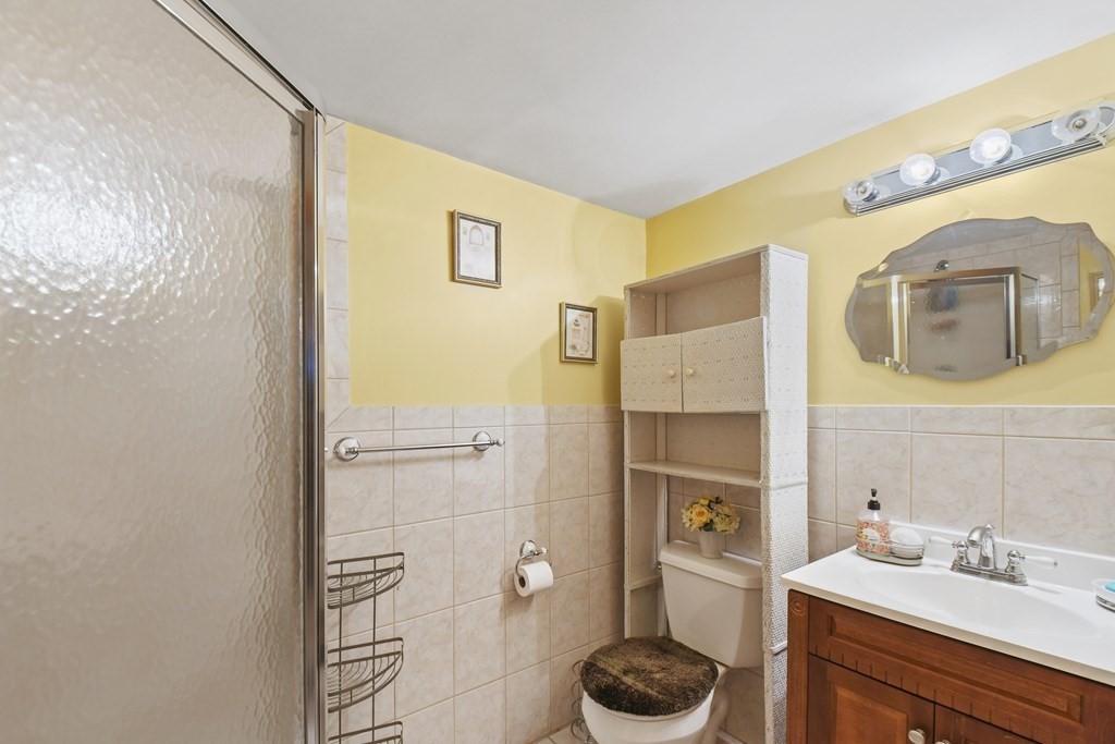 33 Old Farm Road Reading, MA 01867 - Photo 38 of 42 a bathroom with a sink and a mirror