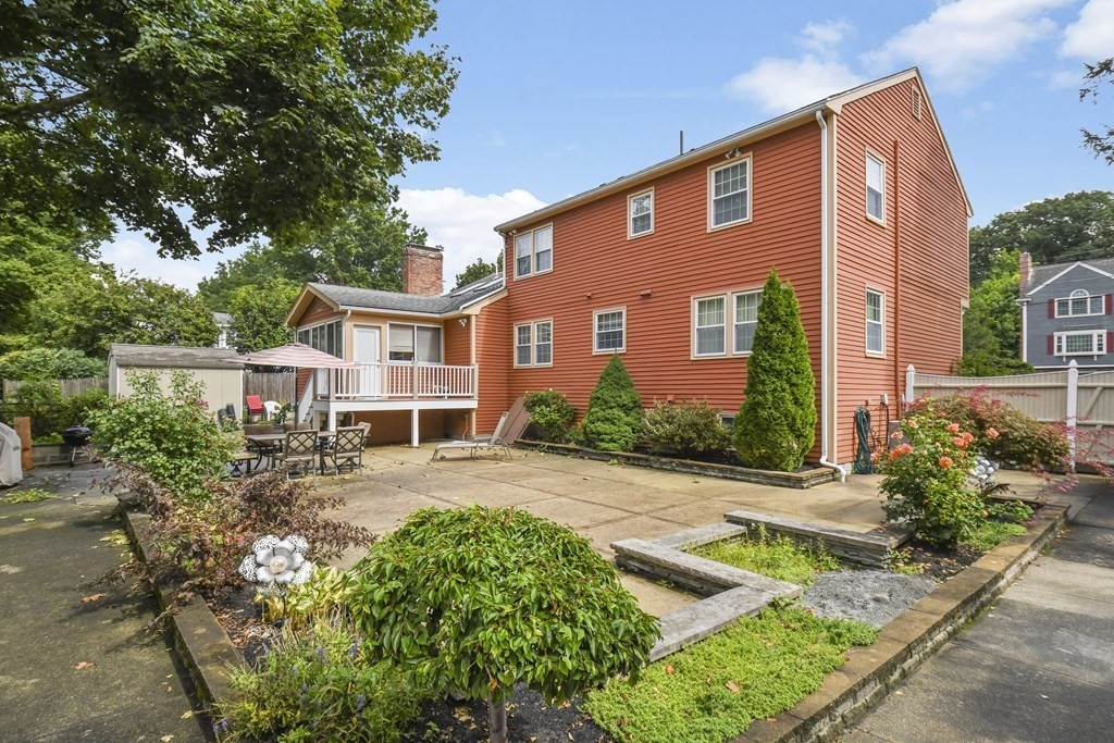 33 Old Farm Road Reading, MA 01867 - Photo 40 of 42 front view of a house with a yard