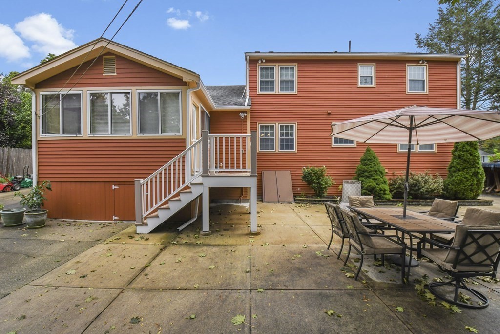 33 Old Farm Road Reading, MA 01867 - Photo 41 of 42 a view of a house with backyard and sitting area