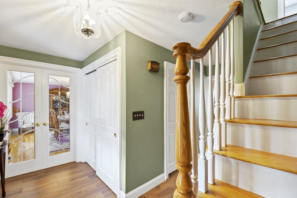 33 Old Farm Road Reading, MA 01867 - Photo 5 of 42 a view of an entryway with wooden floor and door