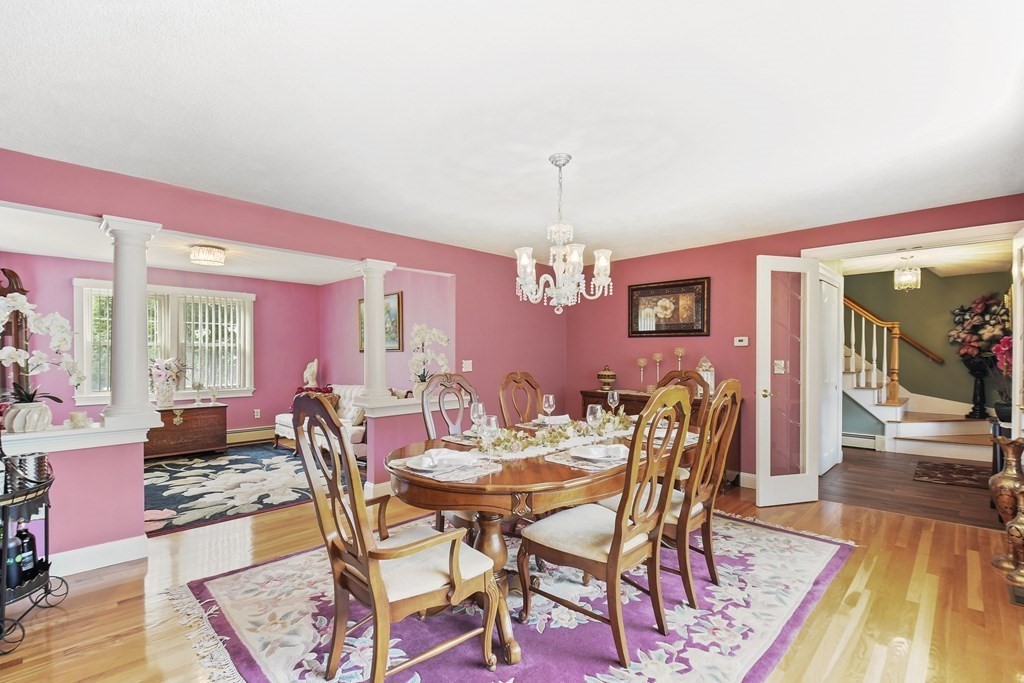 33 Old Farm Road Reading, MA 01867 - Photo 8 of 42 a view of a dining room with furniture window and wooden floor
