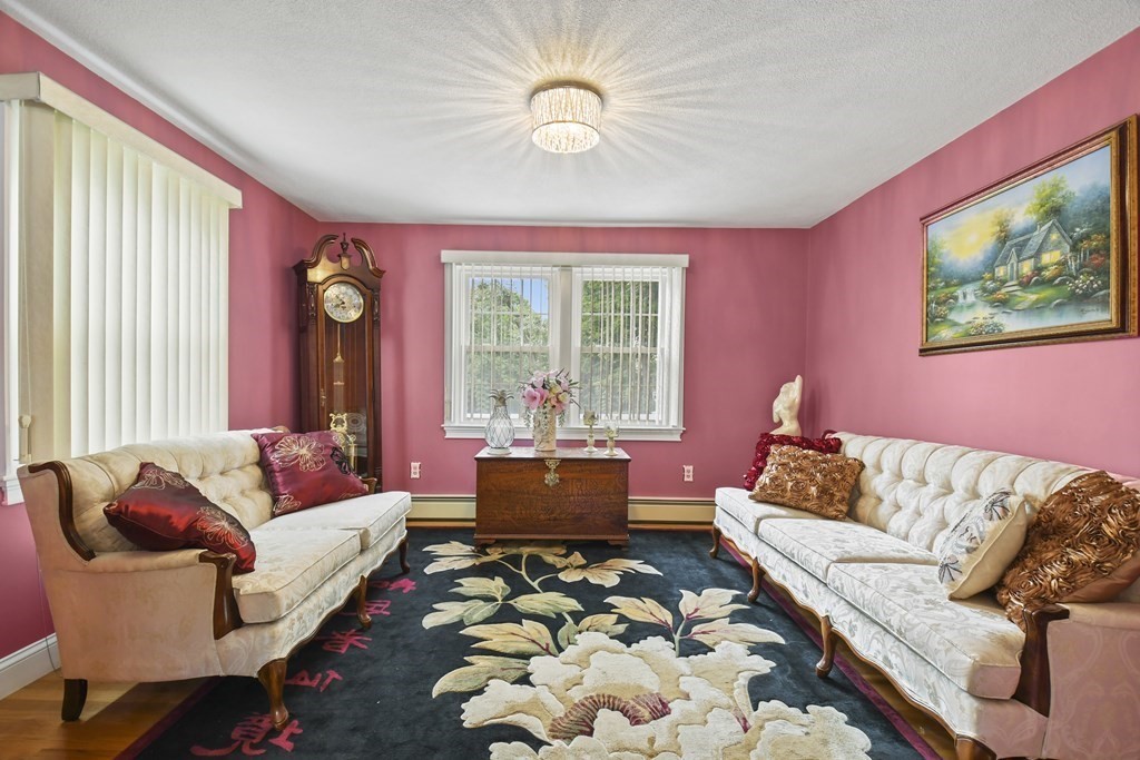 33 Old Farm Road Reading, MA 01867 - Photo 9 of 42 a living room with furniture and a large window