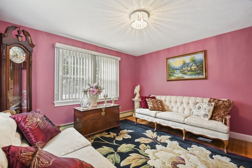 33 Old Farm Road Reading, MA 01867 - Photo 10 of 42 a living room with furniture and a large window