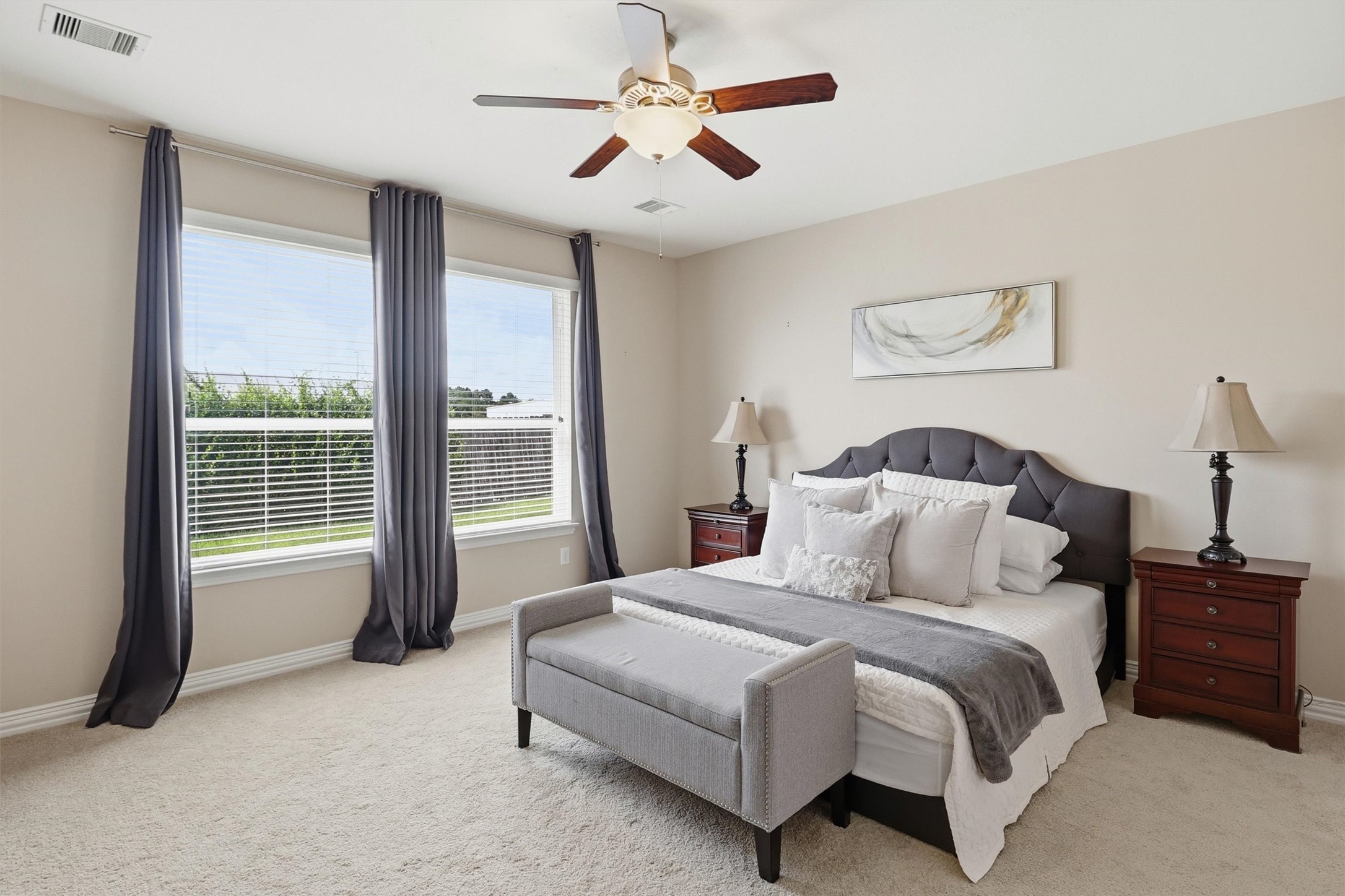 3219 Cotton Ranch Drive Katy, TX 77494 - Photo 16 of 45 Privately tucked away on the main level, the spacious primary suite offers a peaceful escape designed for comfort and relaxation.