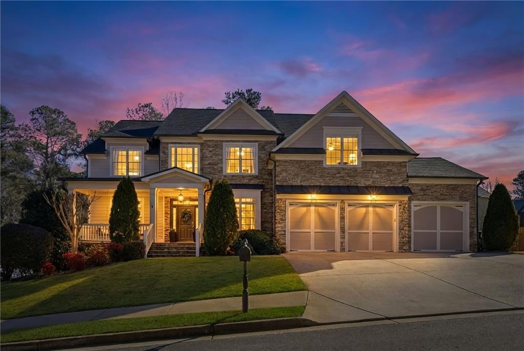 1830 Callaway Ridge Drive Northwest Kennesaw, GA 30152 - Photo 1 of 60 a front view of a house with garden