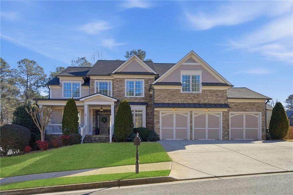 1830 Callaway Ridge Drive Northwest Kennesaw, GA 30152 - Photo 2 of 60 a front view of a house with a garden