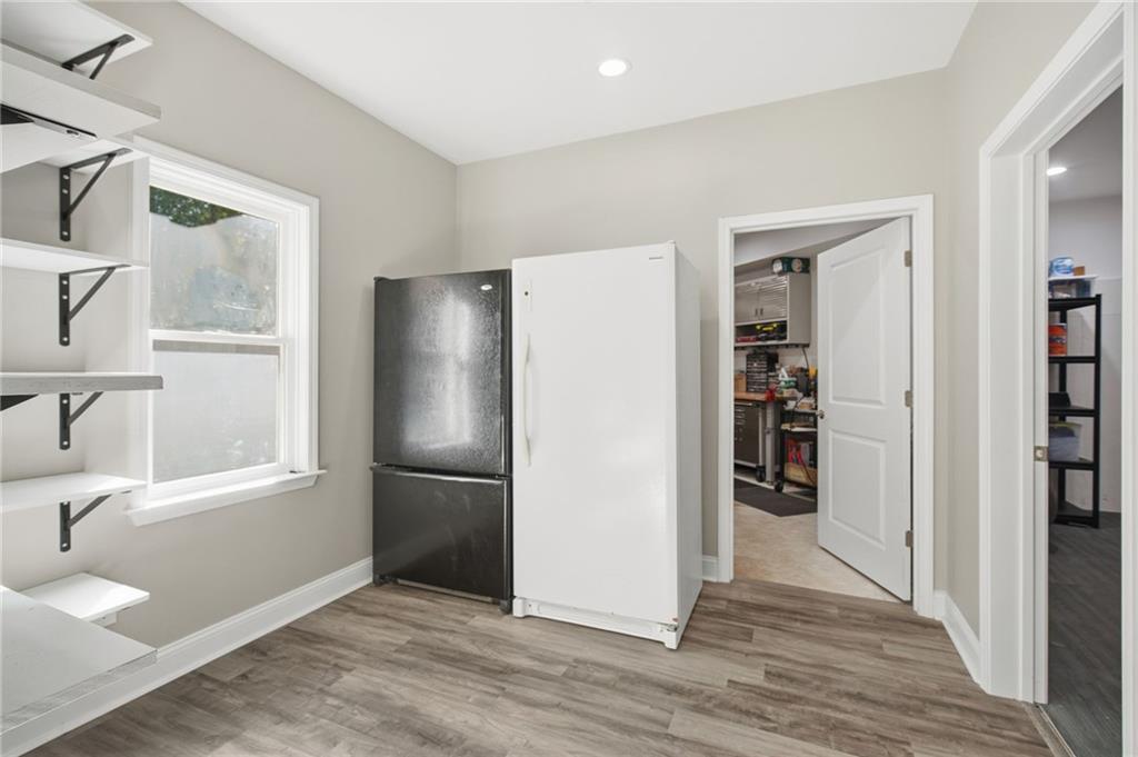 1830 Callaway Ridge Drive Northwest Kennesaw, GA 30152 - Photo 48 of 60 a kitchen with stainless steel appliances granite countertop a refrigerator and a sink