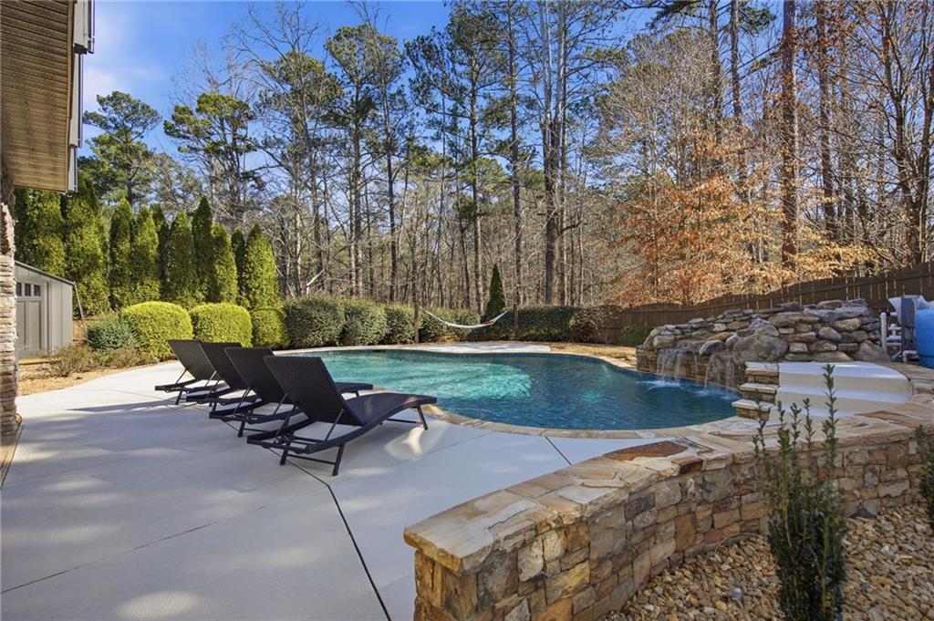 1830 Callaway Ridge Drive Northwest Kennesaw, GA 30152 - Photo 50 of 60 a view of a backyard with sitting area