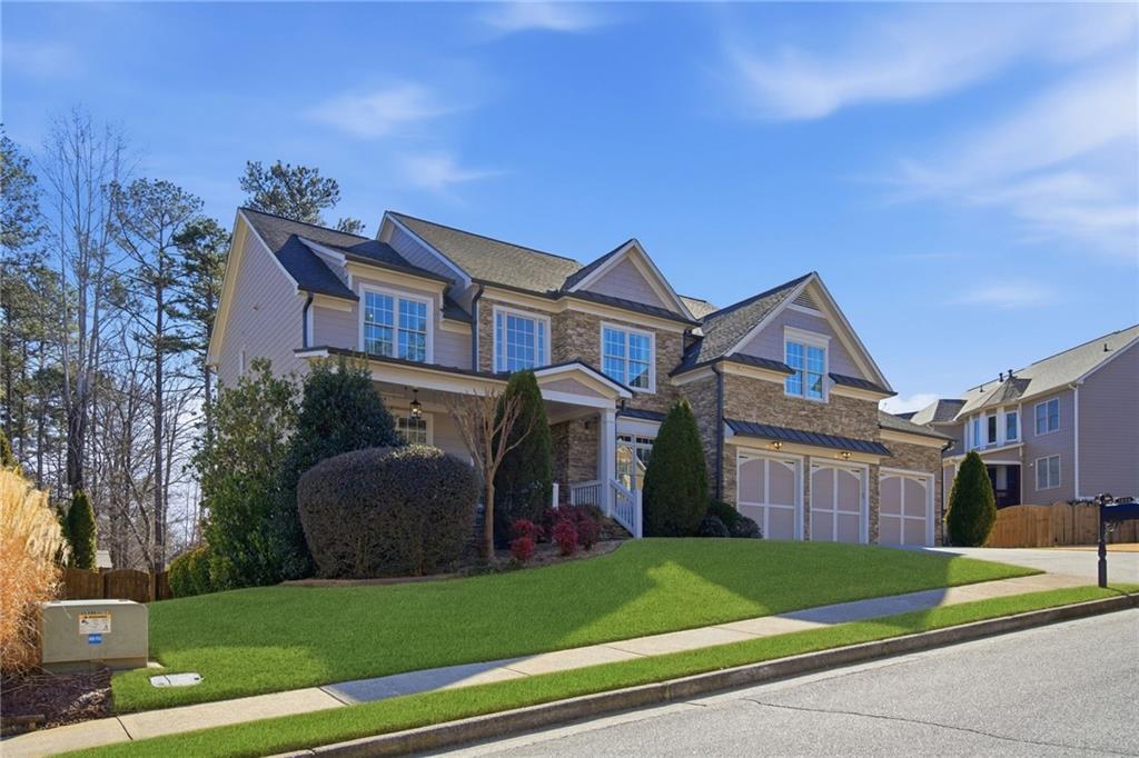 1830 Callaway Ridge Drive Northwest Kennesaw, GA 30152 - Photo 5 of 60 a front view of a house with a yard and trees