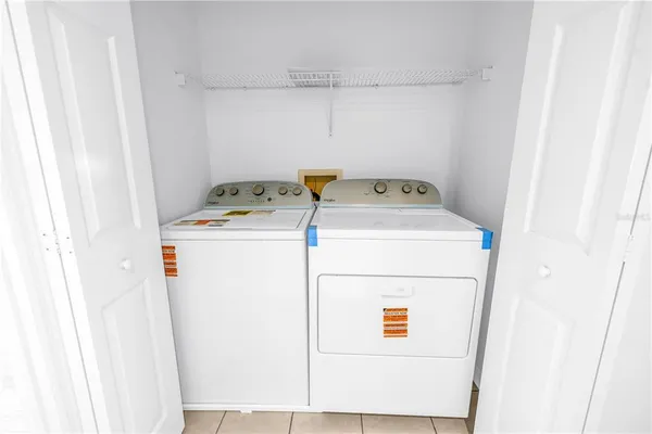 a view of a water with palm trees