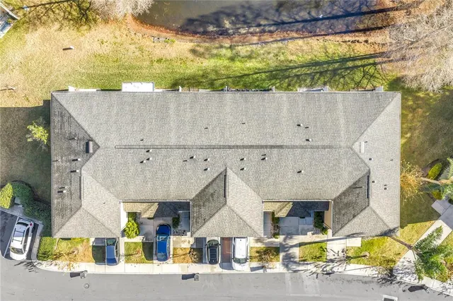 a view of a house with swimming pool and sitting area