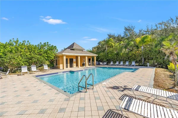 an aerial view of residential building with green space