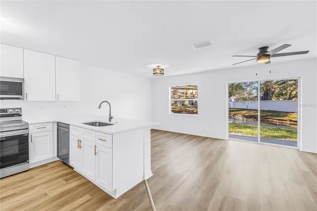 a kitchen with a stove microwave and refrigerator