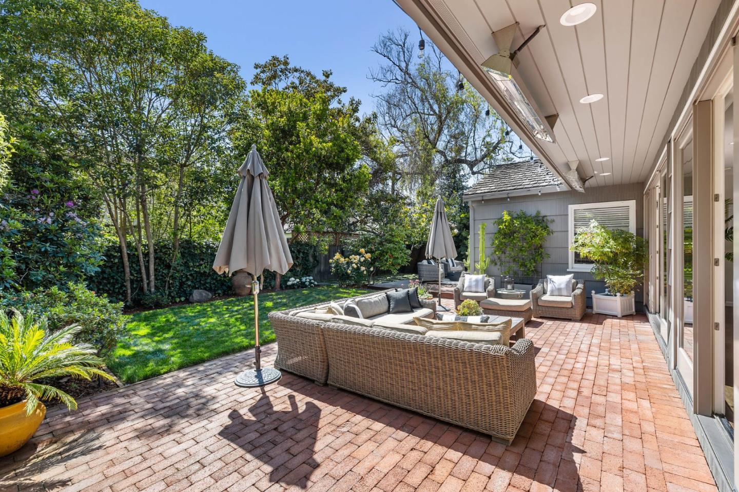 514 Alhambra Road San Mateo, CA 94402 - Photo 13 of 16 a view of a patio with couches and potted plants