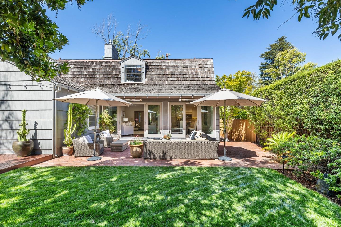 514 Alhambra Road San Mateo, CA 94402 - Photo 14 of 16 a view of a house with a yard patio and furniture