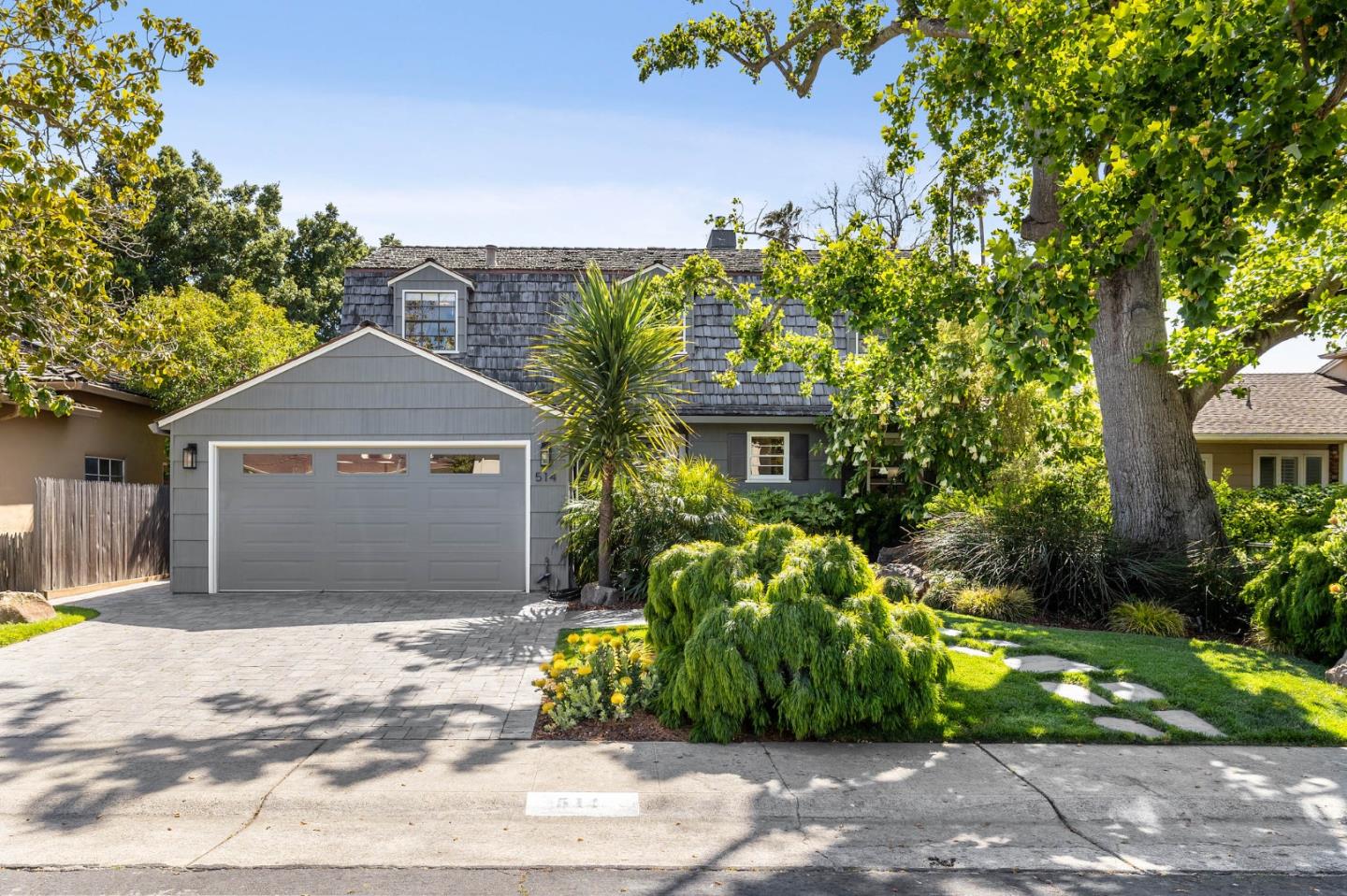 514 Alhambra Road San Mateo, CA 94402 - Photo 2 of 16 a front view of a house with a garden