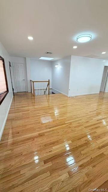 151-28 24th Road Queens, NY 11357 - Photo 4 of 8 Spare room with recessed lighting and light wood-style flooring