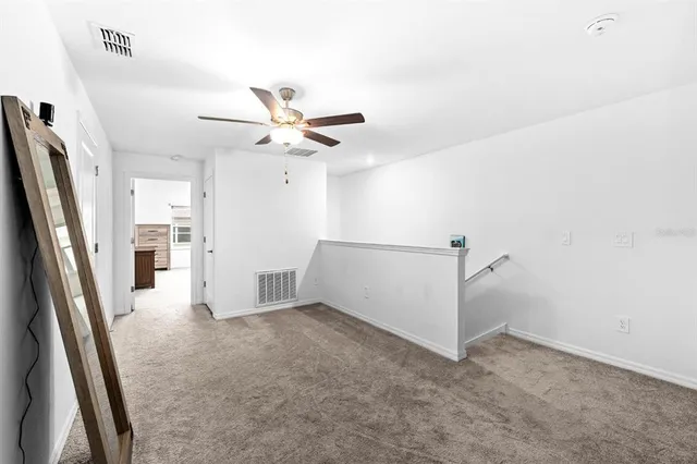 a view of a livingroom with a ceiling fan