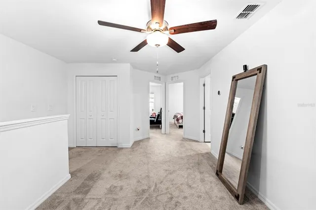 a view of an empty room with a fireplace