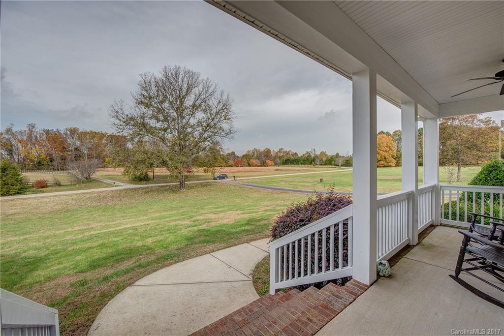 1072 Arabian Farm Road, Unit 9 Clover, SC 29710 - Photo 2 of 24 a view of a patio with wooden floor and fence next to a yard