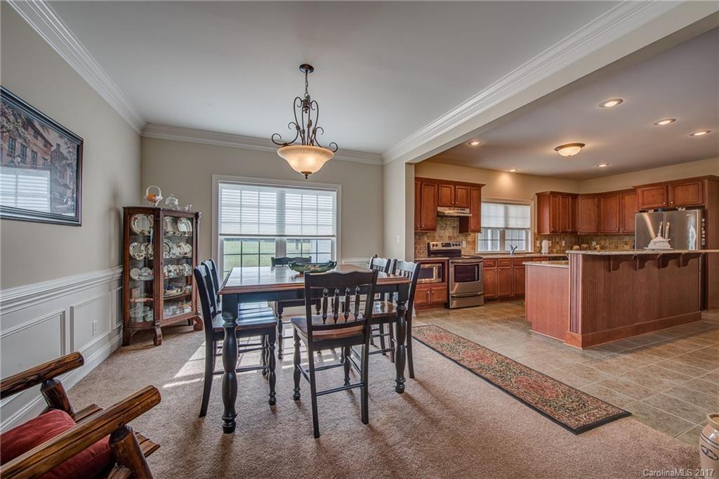 1072 Arabian Farm Road, Unit 9 Clover, SC 29710 - Photo 14 of 24 a view of a dining room with furniture window and wooden floor