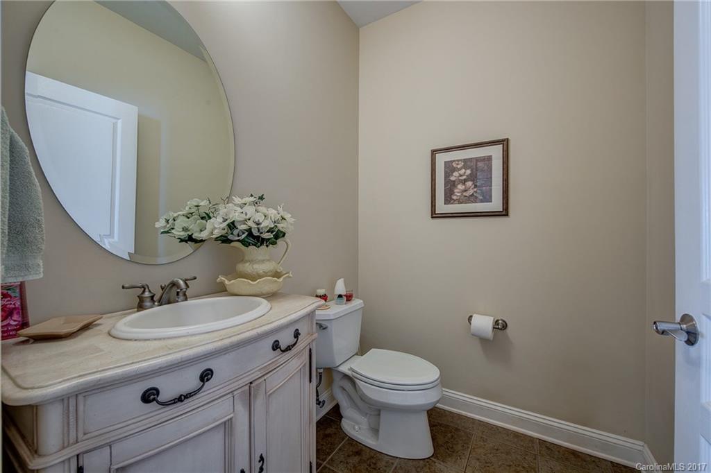 1072 Arabian Farm Road, Unit 9 Clover, SC 29710 - Photo 17 of 24 a bathroom with a sink vanity mirror and toilet