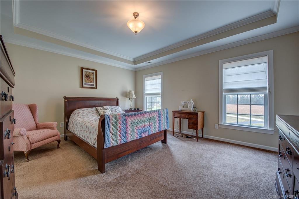 1072 Arabian Farm Road, Unit 9 Clover, SC 29710 - Photo 20 of 24 a spacious bedroom with a bed and a couch