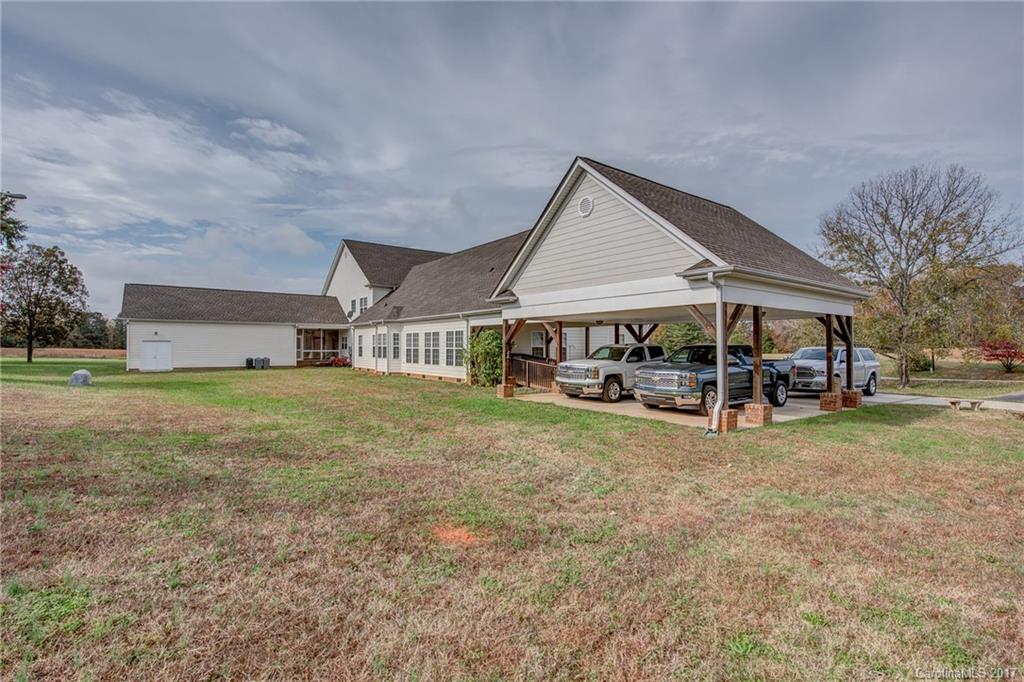 1072 Arabian Farm Road, Unit 9 Clover, SC 29710 - Photo 24 of 24 a view of a house with backyard and sitting area