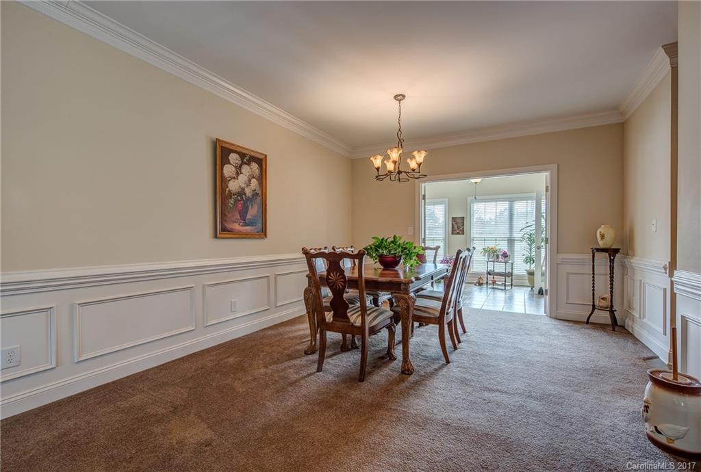 1072 Arabian Farm Road, Unit 9 Clover, SC 29710 - Photo 5 of 24 a view of a dining room with furniture and chandelier