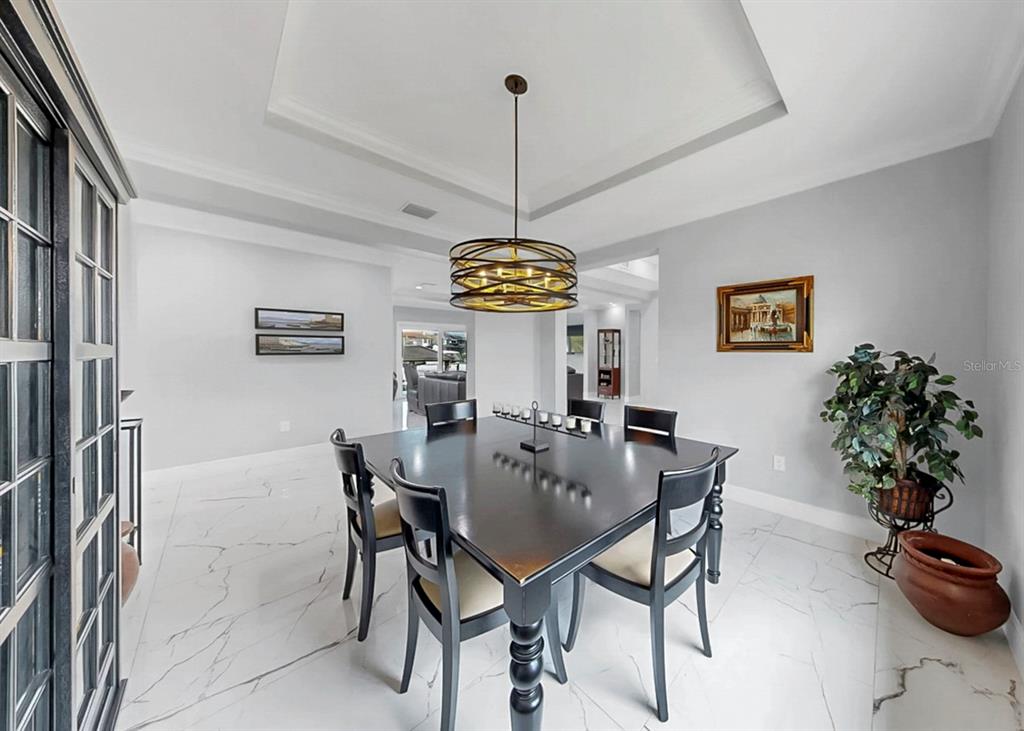 901 Capriccio Lane Apollo Beach, FL 33572 - Photo 29 of 83 a view of a dining room with furniture