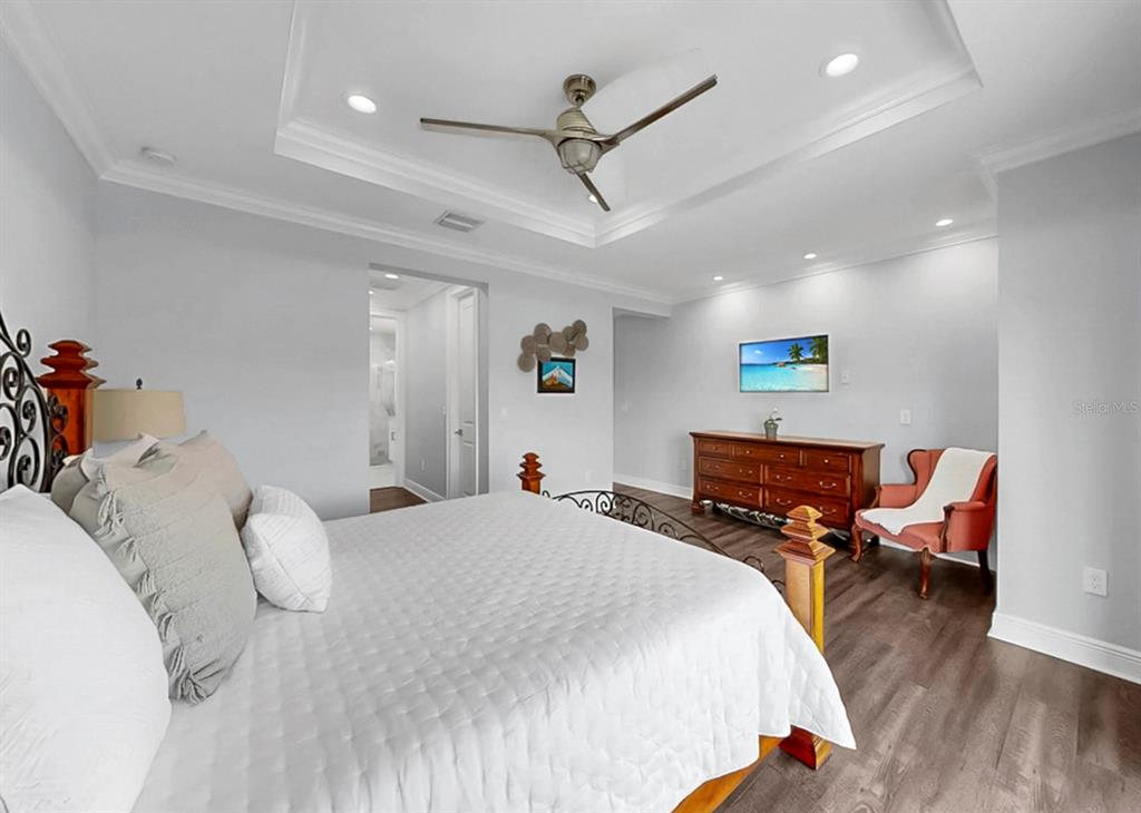 901 Capriccio Lane Apollo Beach, FL 33572 - Photo 32 of 83 a bed room with a bed and a couch