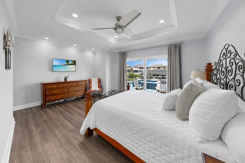901 Capriccio Lane Apollo Beach, FL 33572 - Photo 34 of 83 a bedroom with a bed and a large window