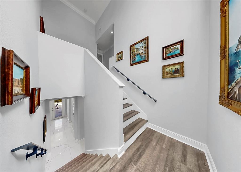 901 Capriccio Lane Apollo Beach, FL 33572 - Photo 40 of 83 a view of hallway with stairs and wooden floor