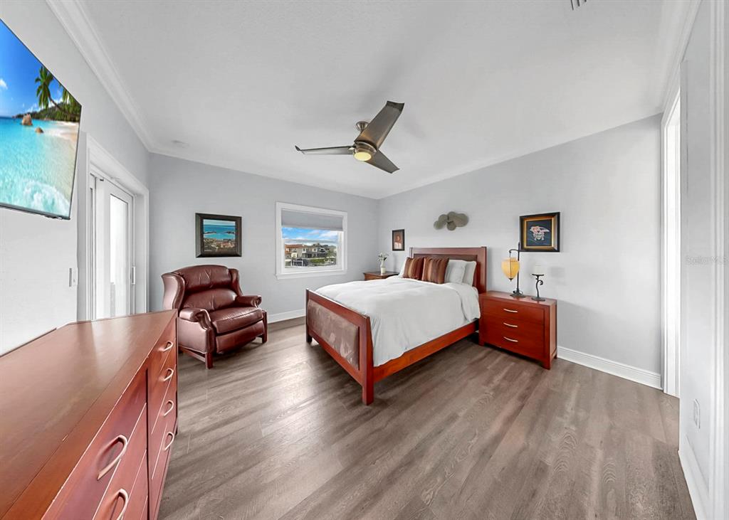 901 Capriccio Lane Apollo Beach, FL 33572 - Photo 46 of 83 a bedroom with a bed couch and window