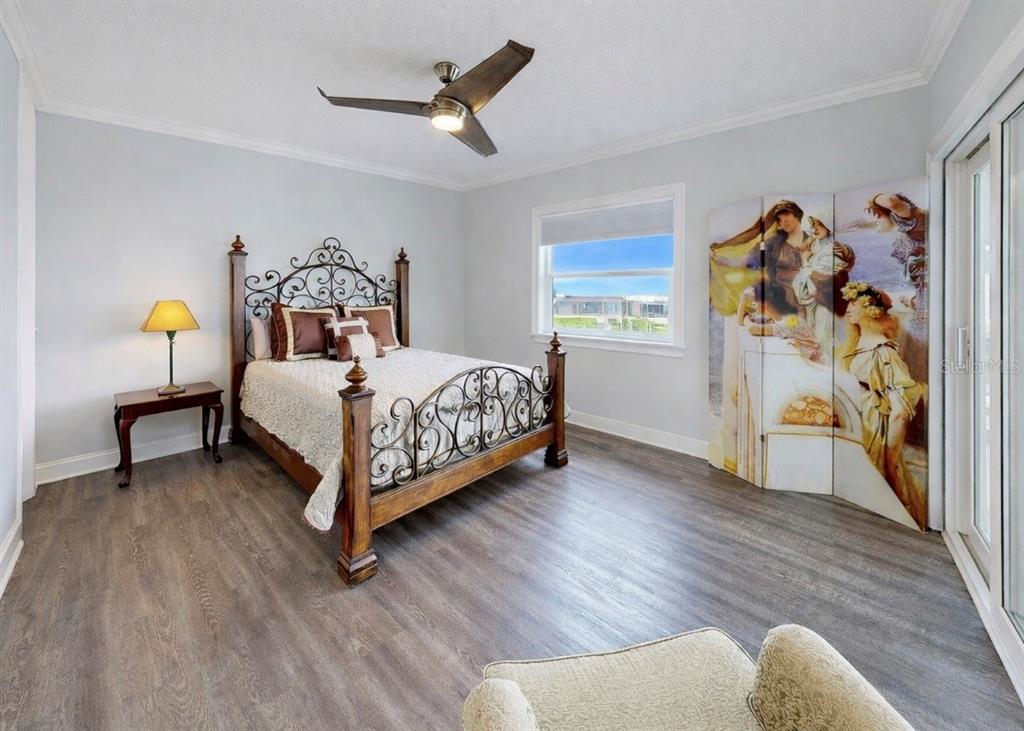 901 Capriccio Lane Apollo Beach, FL 33572 - Photo 48 of 83 a bedroom with a bed and a window