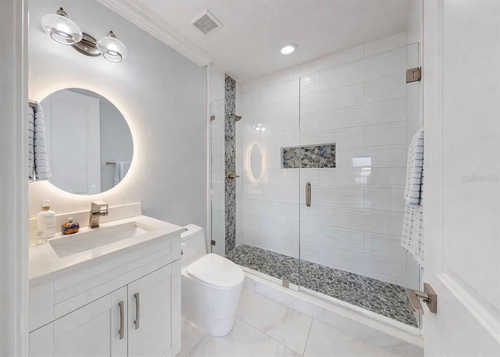 901 Capriccio Lane Apollo Beach, FL 33572 - Photo 49 of 83 a bathroom with a sink a toilet and shower