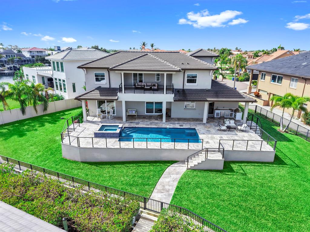 901 Capriccio Lane Apollo Beach, FL 33572 - Photo 61 of 83 a view of a house with a yard patio and a garden