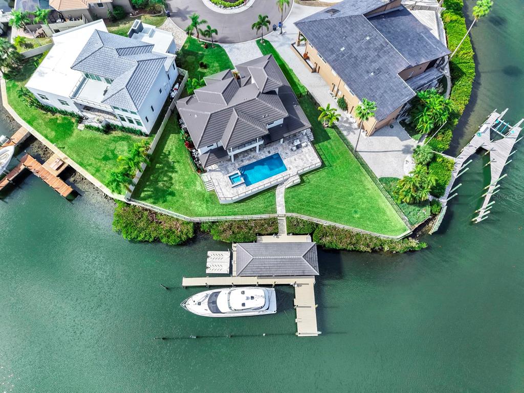 901 Capriccio Lane Apollo Beach, FL 33572 - Photo 72 of 83 an aerial view of a house with garden space and swimming pool