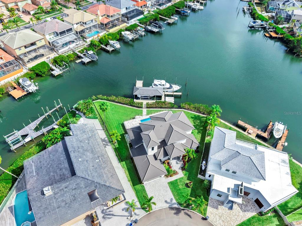 901 Capriccio Lane Apollo Beach, FL 33572 - Photo 73 of 83 an aerial view of a house with a garden and lake view