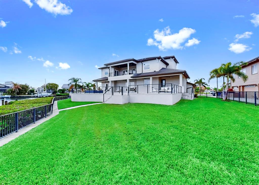 901 Capriccio Lane Apollo Beach, FL 33572 - Photo 74 of 83 a view of a house with a backyard porch and sitting area