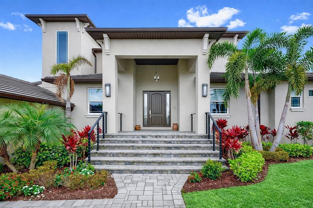 901 Capriccio Lane Apollo Beach, FL 33572 - Photo 9 of 83 a front view of a house with a yard