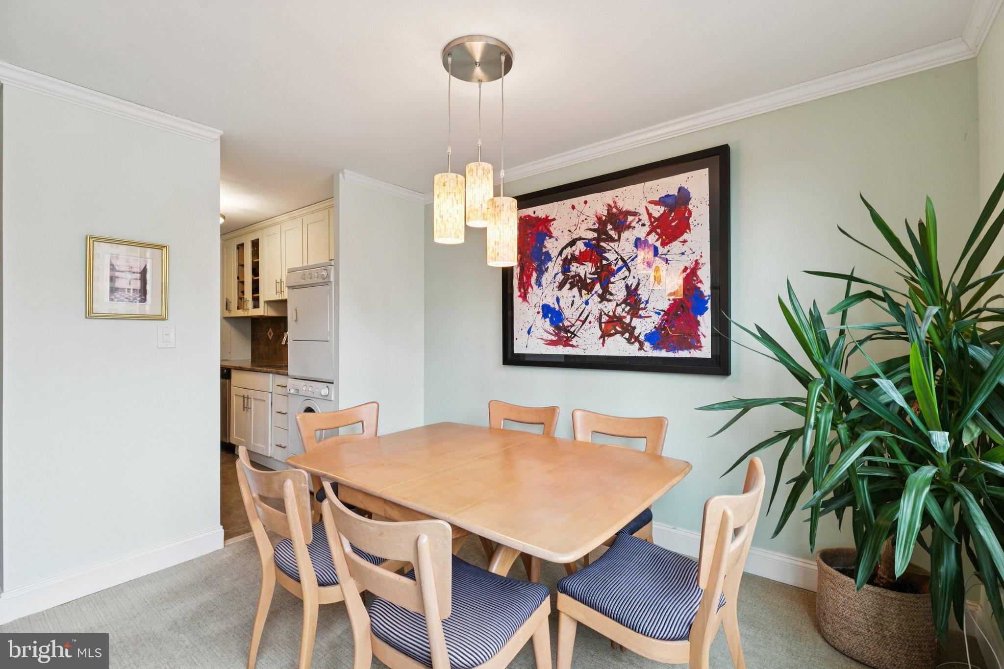 1919 Chestnut Street, Unit 707 Philadelphia, PA 19103 - Photo 12 of 36 a view of a dining room with furniture window and wooden floor