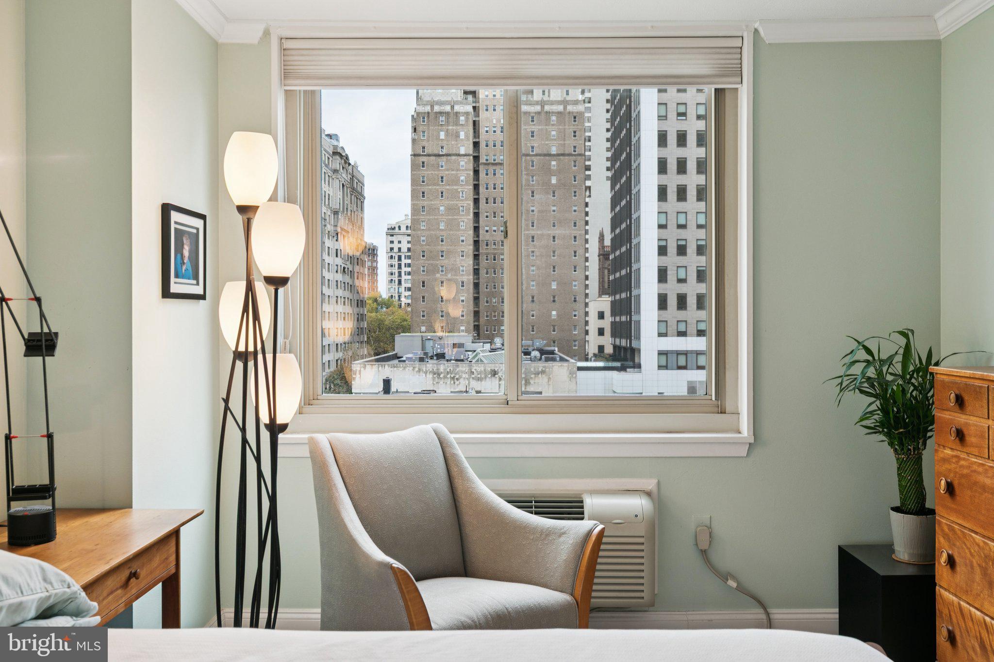 1919 Chestnut Street, Unit 707 Philadelphia, PA 19103 - Photo 20 of 36 a living room with furniture and a window