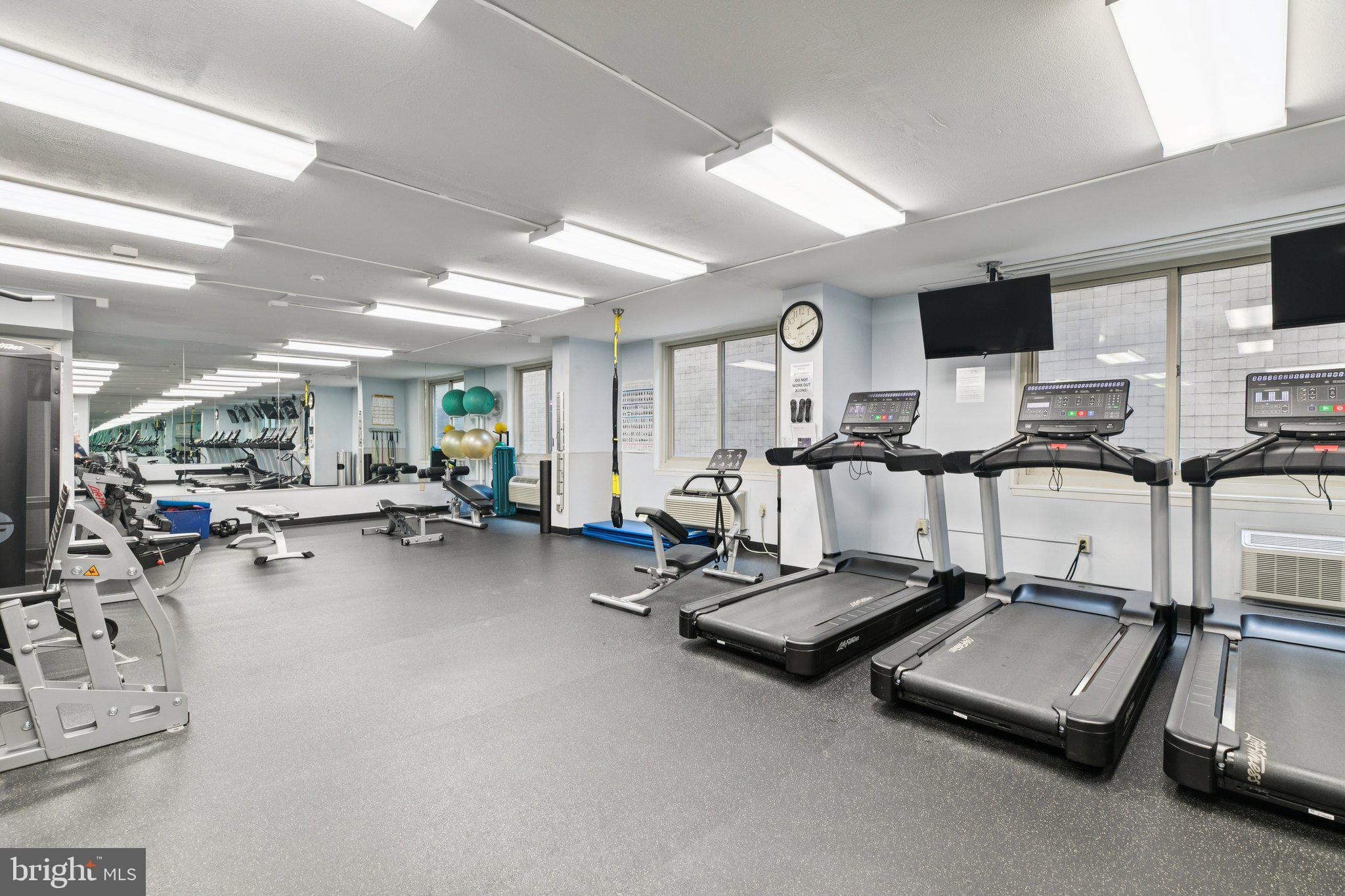 1919 Chestnut Street, Unit 707 Philadelphia, PA 19103 - Photo 30 of 36 a room with gym equipment and a table